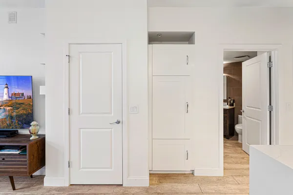 a bathroom with a shower sink and mirror