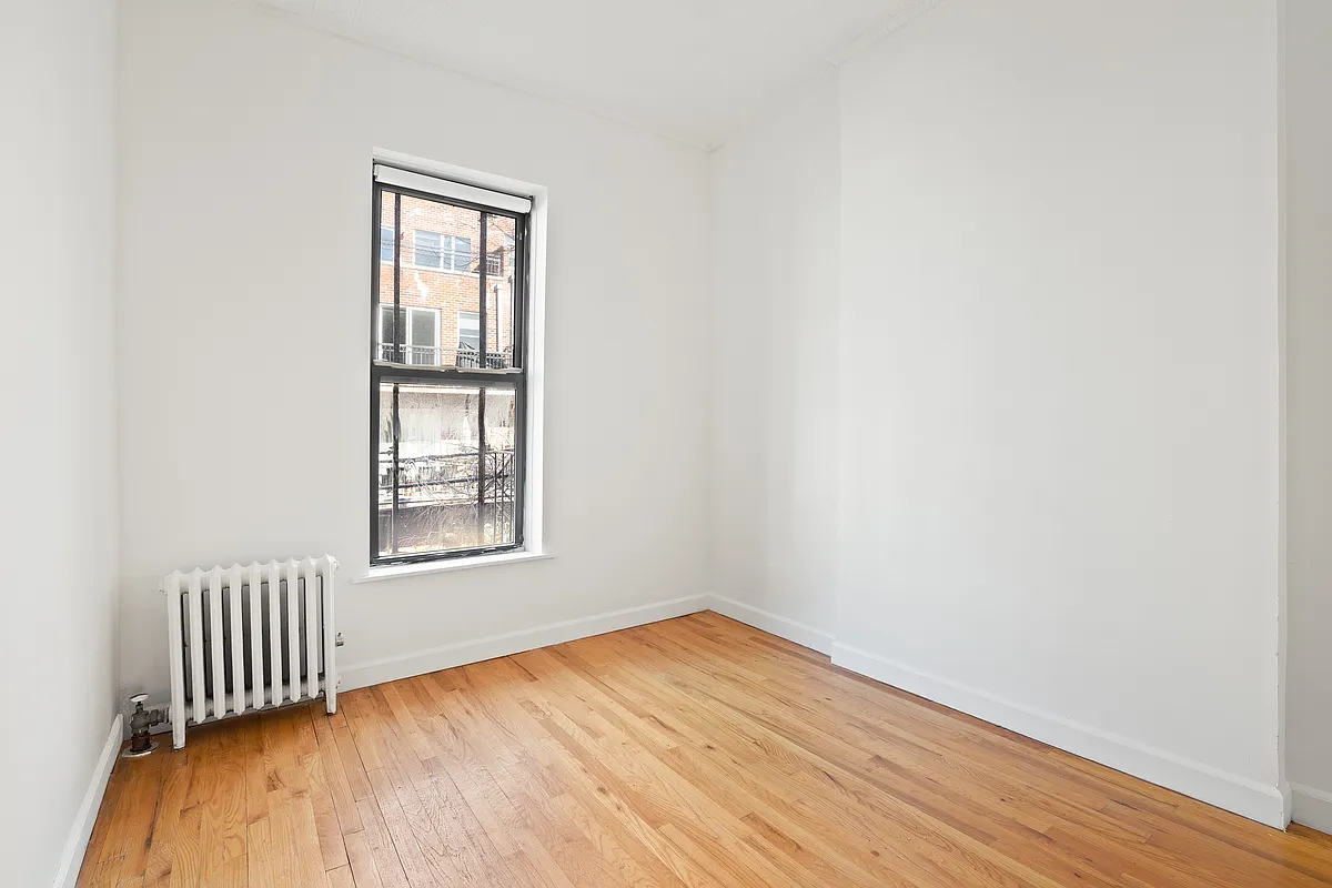 325 3rd Street, Unit 2B Brooklyn, NY 11215 - Photo 5 of 9 an empty room with wooden floor and windows