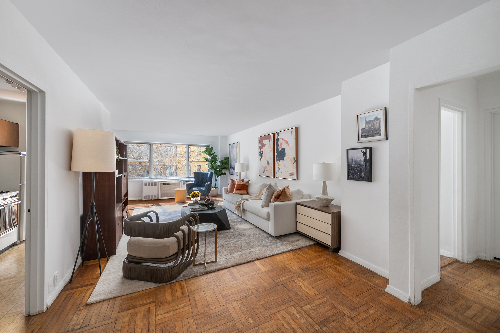 311 East 71st Street, Unit 3F Manhattan, NY 10021 - Photo 1 of 6 a living room with furniture and a window