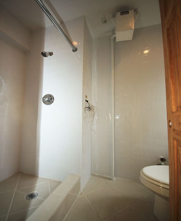 56 MacDougal Street, Unit 16 Manhattan, NY 10012 - Photo 6 of 6 a bathroom with a shower and toilet