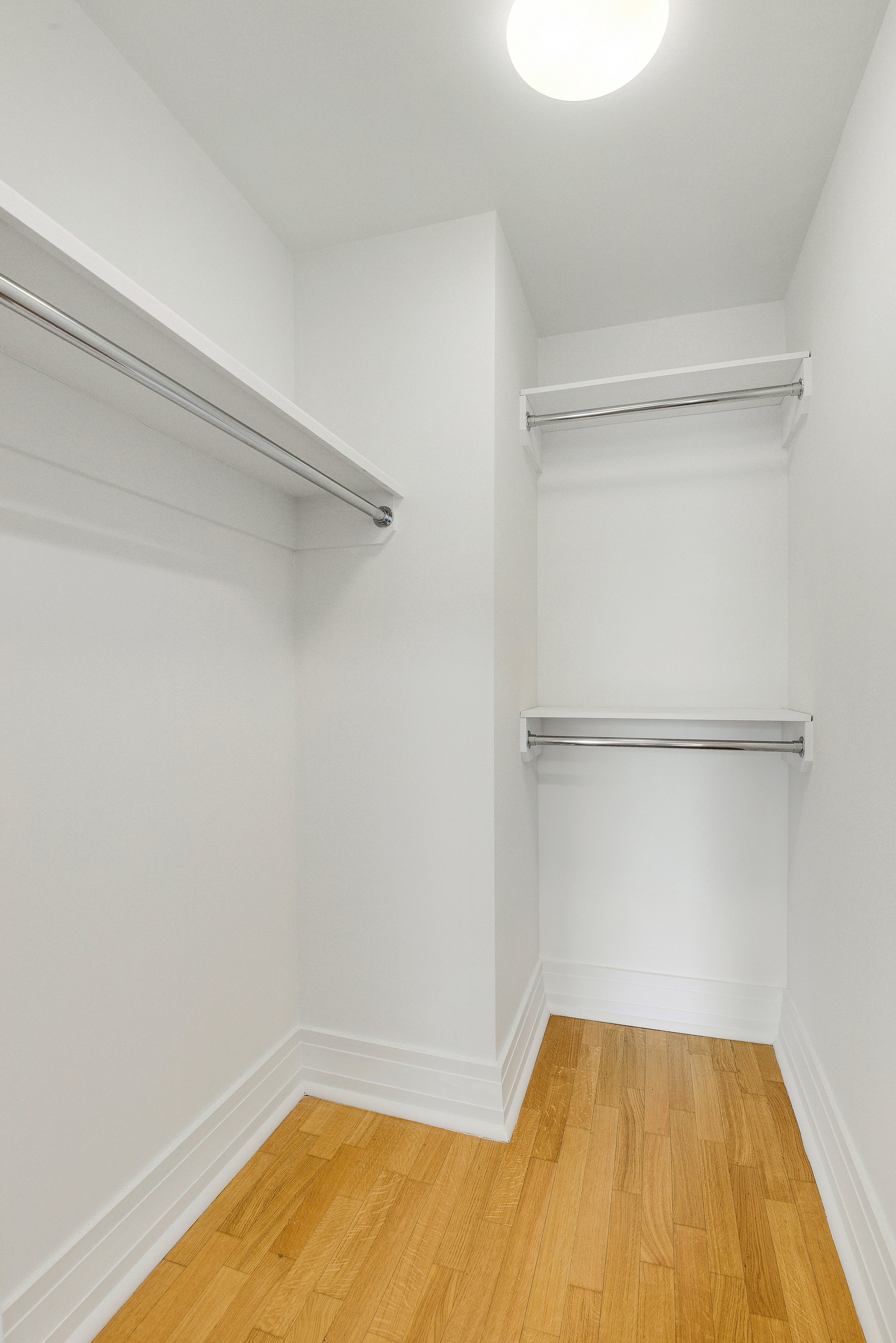 205 East 85th Street, Unit 12H Manhattan, NY 10028 - Photo 15 of 19 a view of a room with racks on the wall