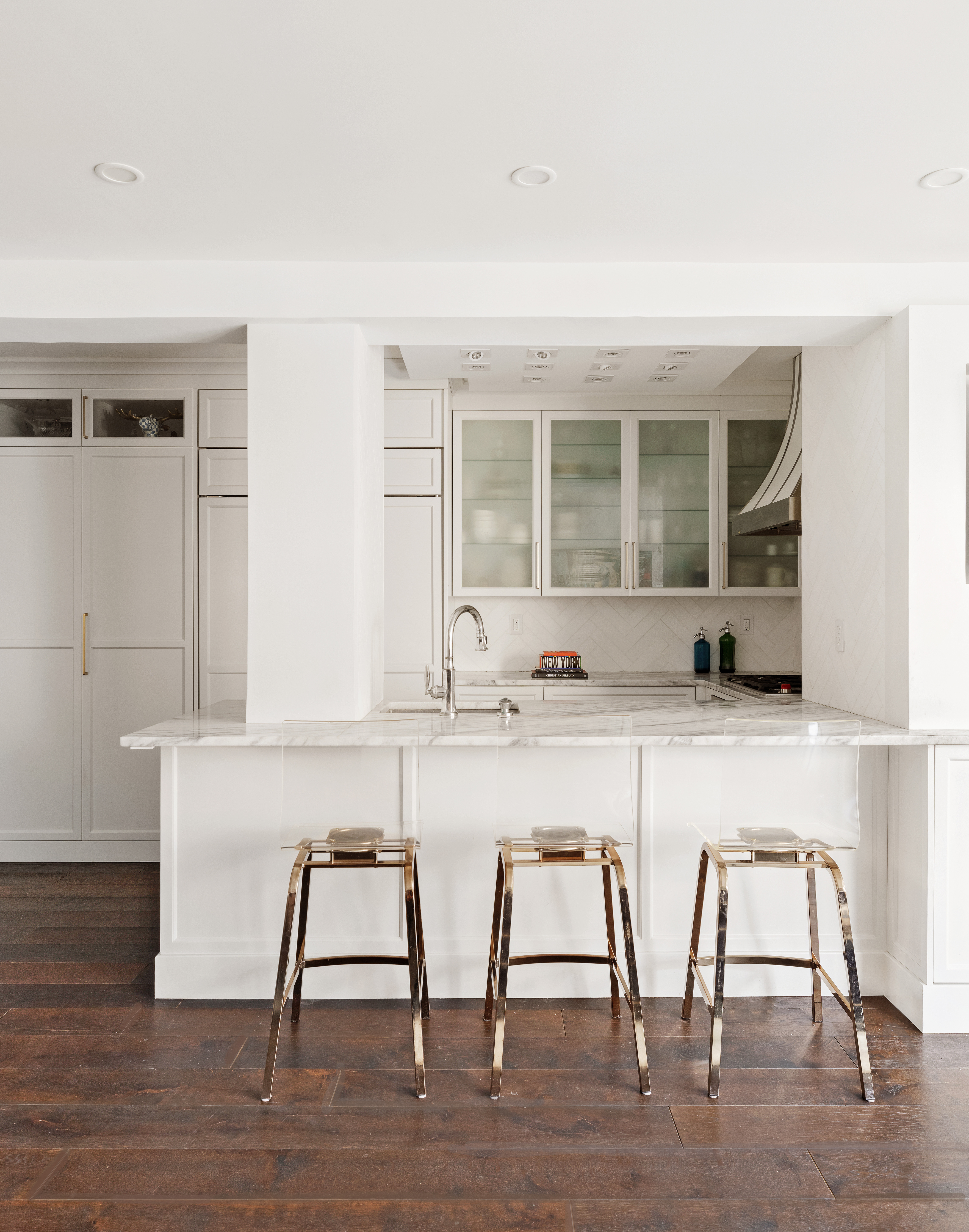 11 5th Avenue, Unit 8AB Manhattan, NY 10003 - Photo 3 of 15 a white kitchen with a sink cabinets and wooden floor