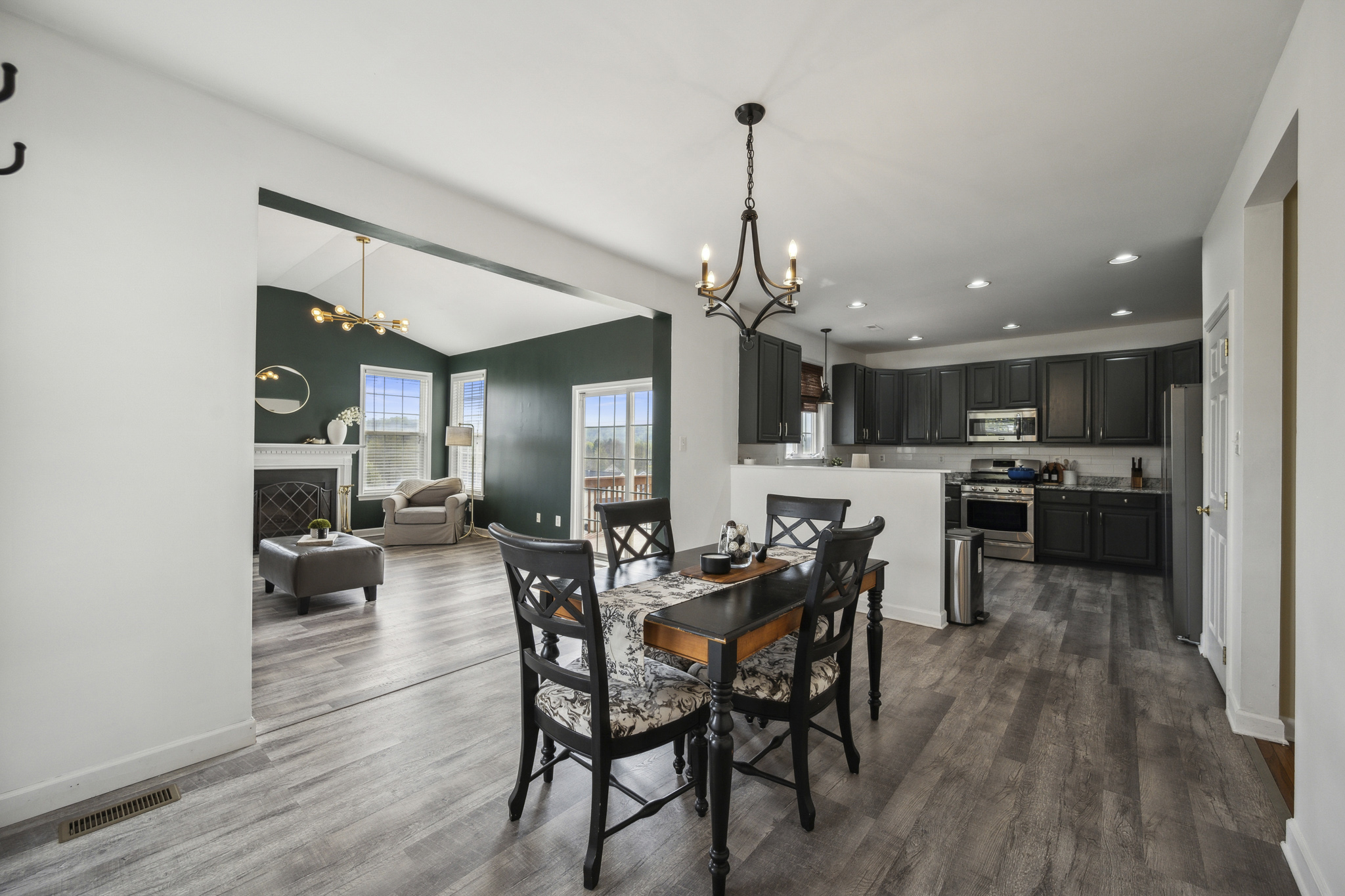127 Hartman Road Pottstown, PA 19465 - Photo 7 of 42 a view of a dining room and livingroom with furniture wooden floor a chandelier