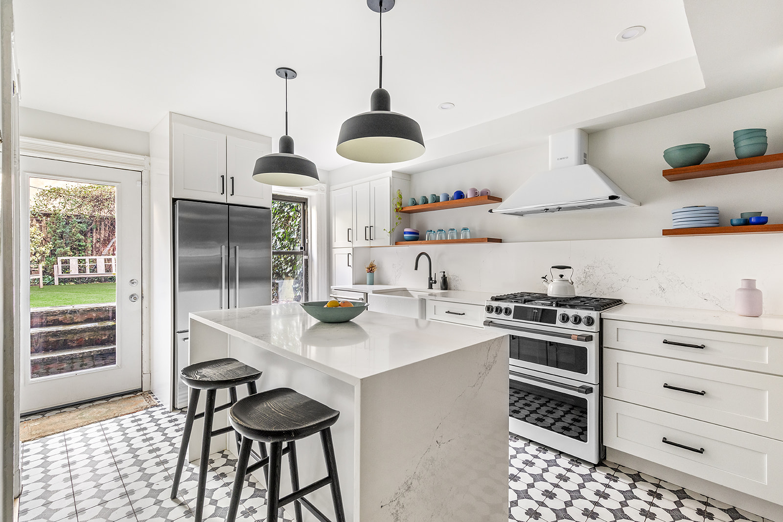 331 A Stuyvesant Avenue Brooklyn, NY 11233 - Photo 2 of 21 a kitchen with stainless steel appliances a stove a sink and a refrigerator