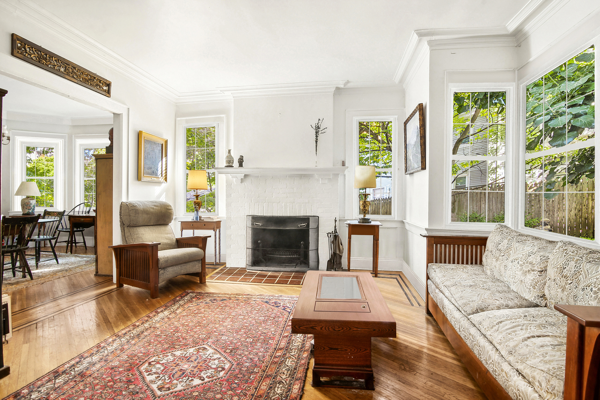 819 East 19th Street Brooklyn, NY 11230 - Photo 2 of 16 a living room with furniture and a fireplace