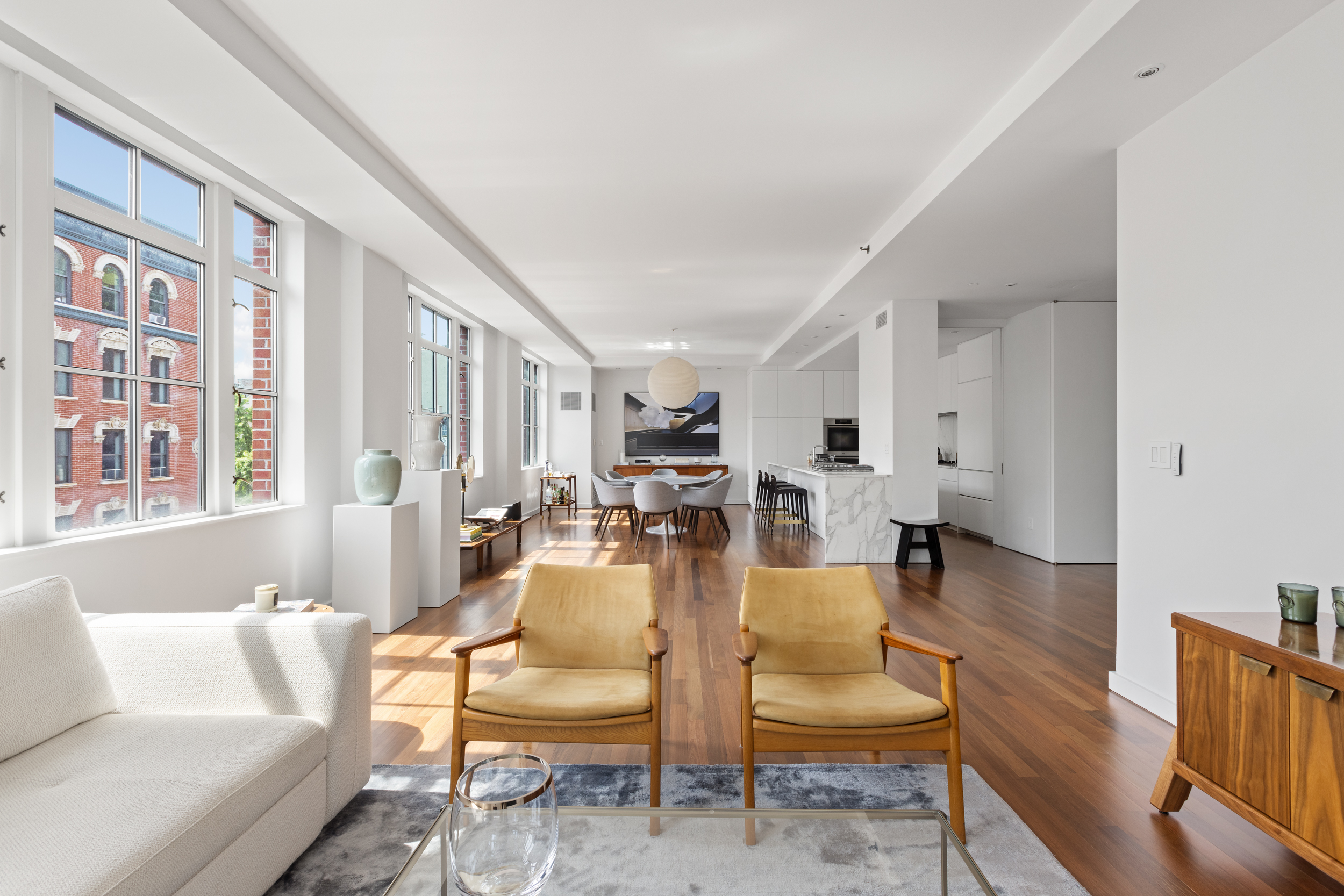 744 Greenwich Street, Unit 4 Manhattan, NY 10014 - Photo 4 of 34 a living room with furniture and a large window