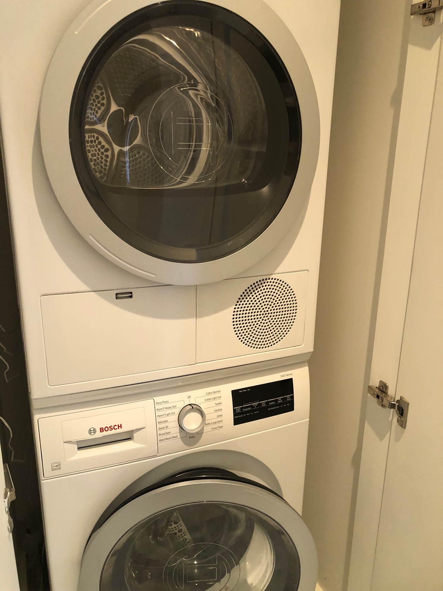 117 East 57th Street, Unit 21H Manhattan, NY 10022 - Photo 12 of 26 a close up view of washer and dryer