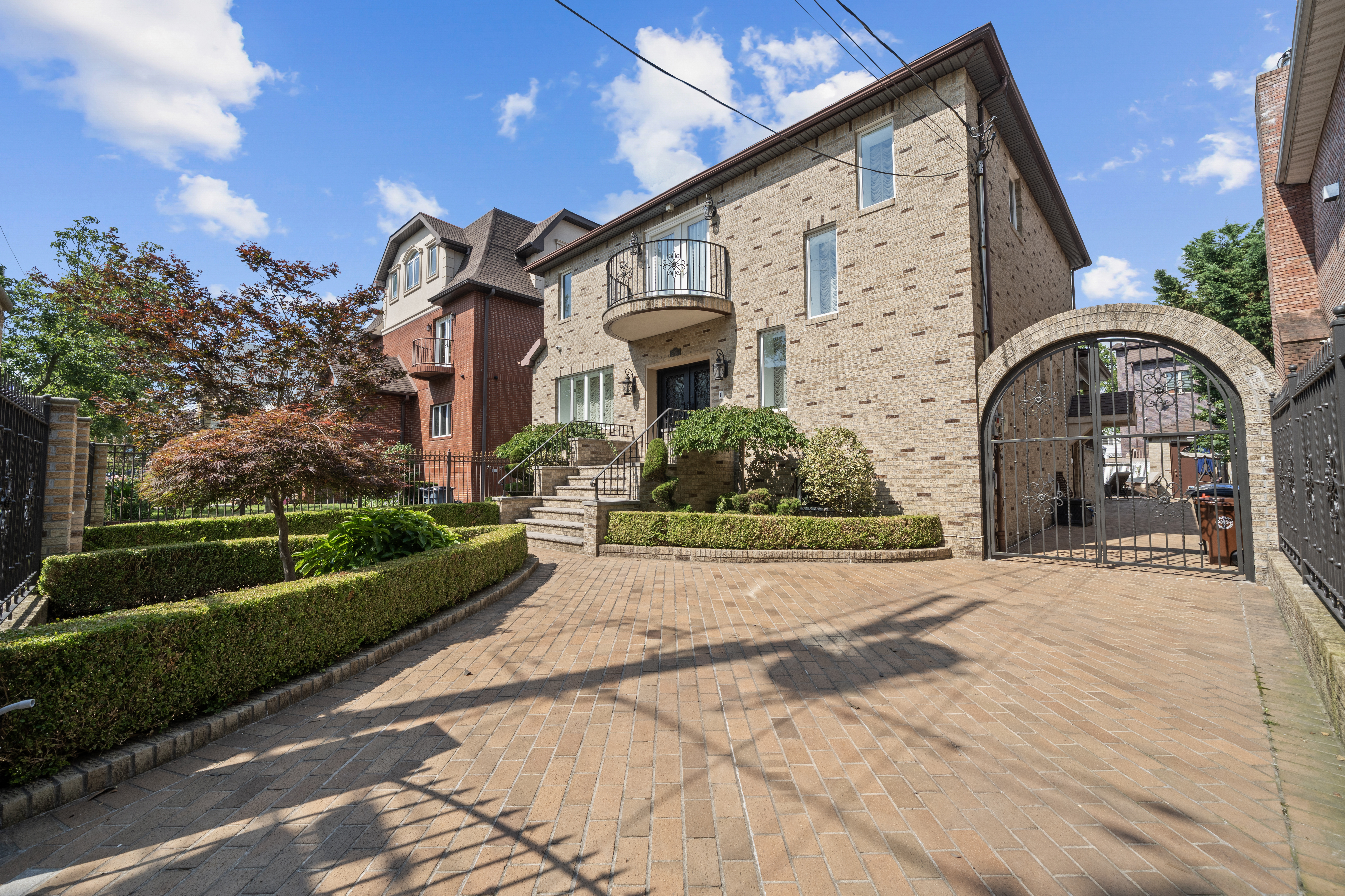 2253 East 64th Street Brooklyn, NY 11234 - Photo 3 of 45 a front view of a house with garden