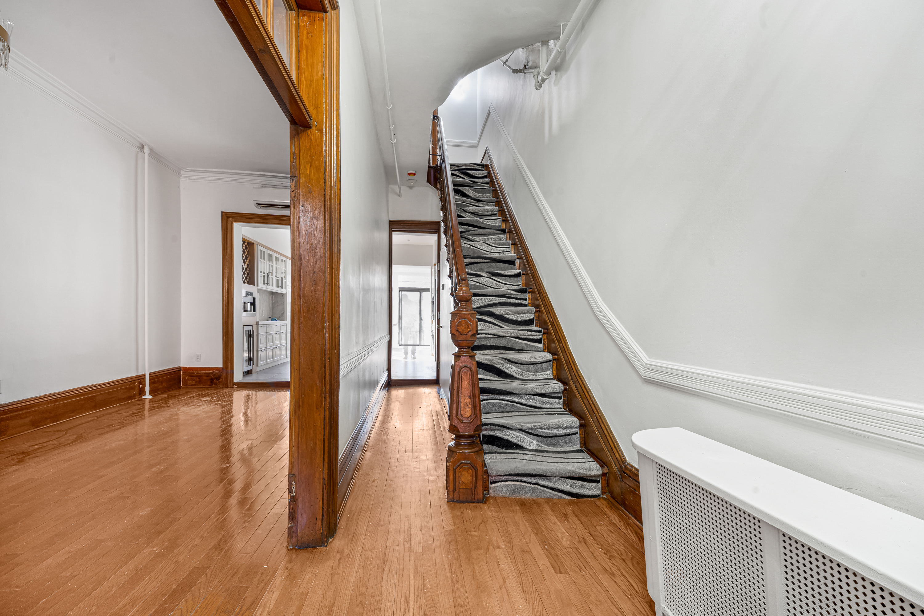 458 West 153rd Street Manhattan, NY 10031 - Photo 6 of 21 a view of an entryway with wooden floor