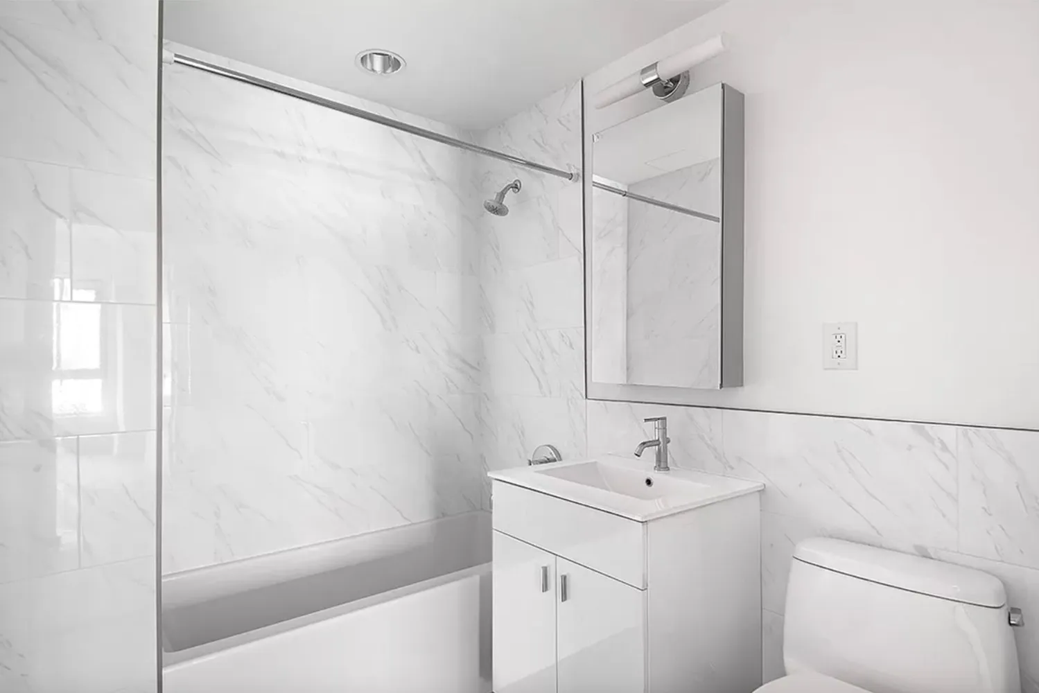 a bathroom with a sink a mirror and a shower