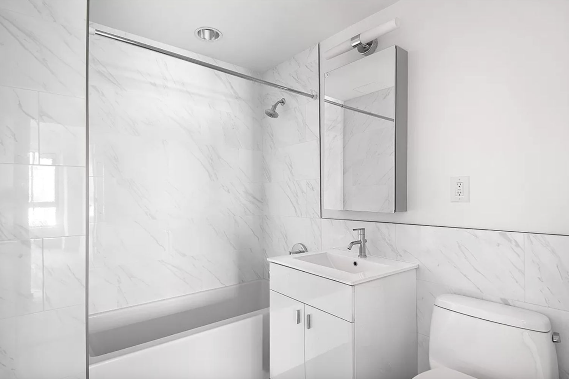 171 West 131st Street, Unit PH4 Manhattan, NY 10027 - Photo 4 of 10 a bathroom with a sink a mirror and a shower