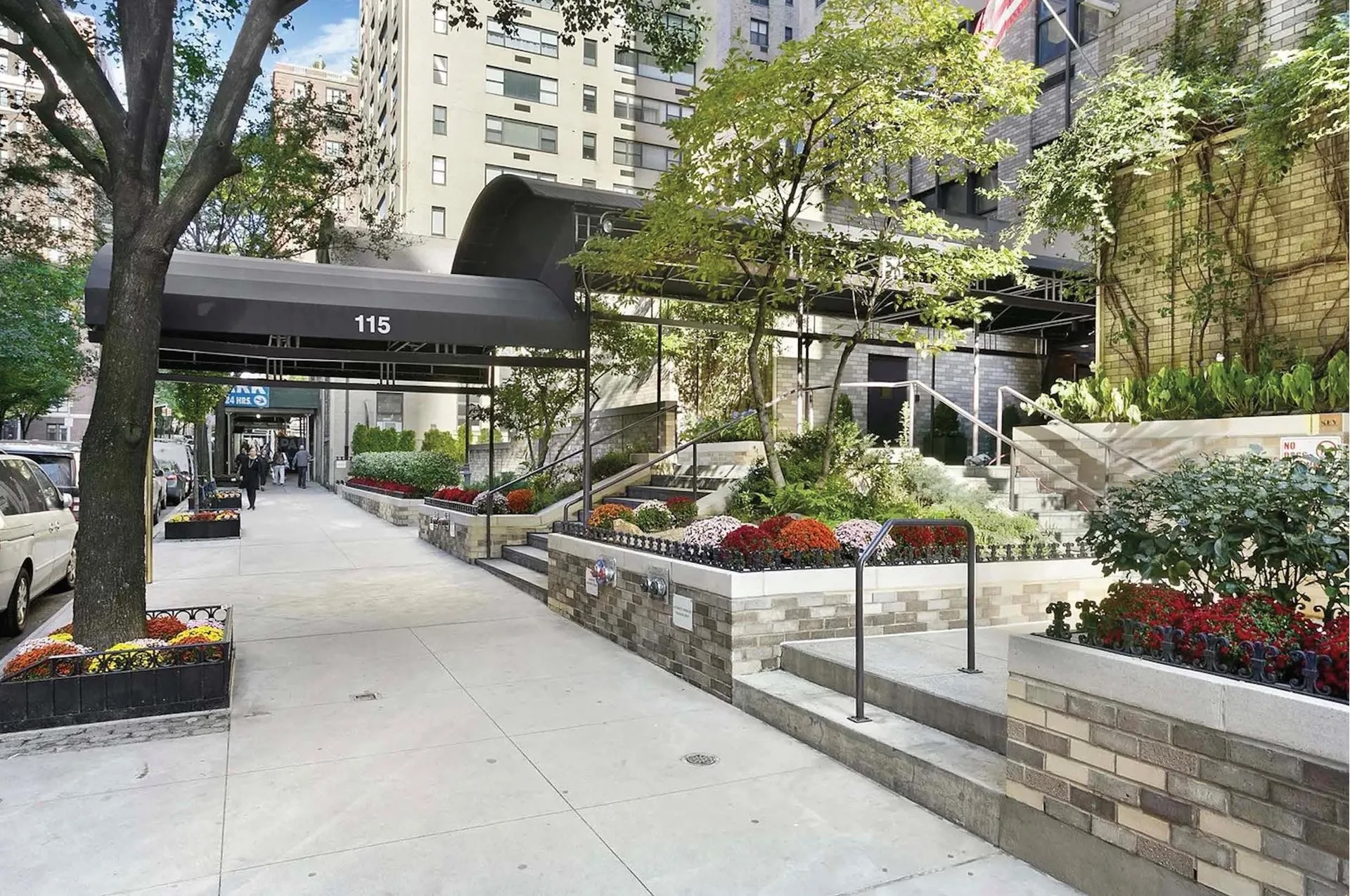 115 East 87th Street, Unit 18A Manhattan, NY 10128 - Photo 12 of 13 a view of a patio with table and chairs potted plants and large trees