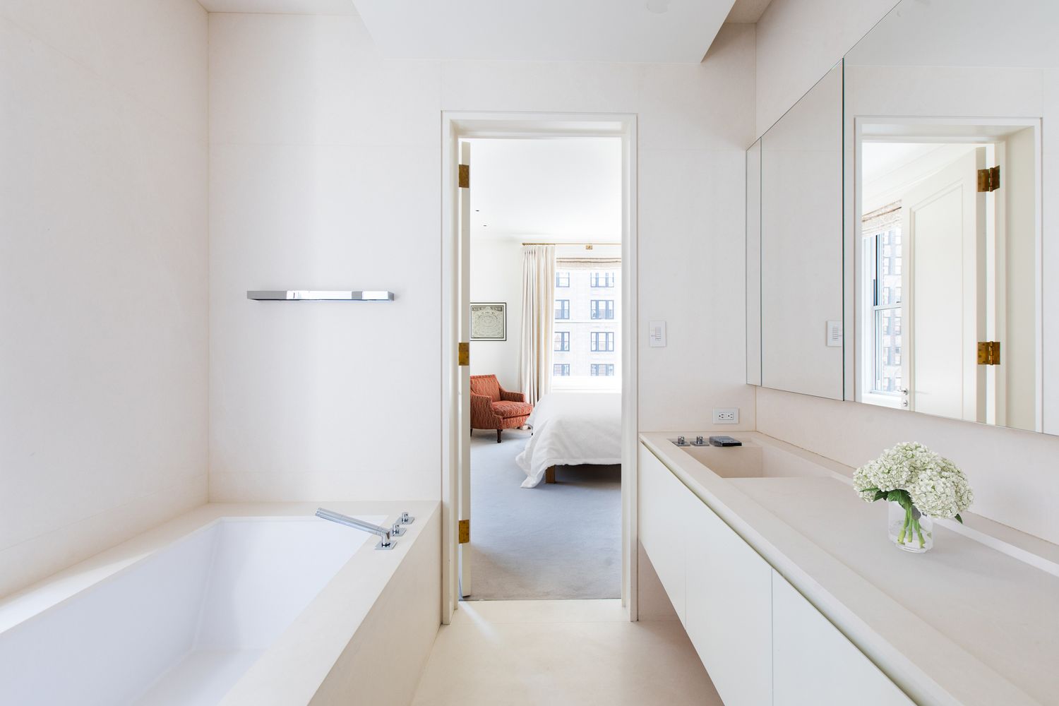 876 Park Avenue, Unit 7N Manhattan, NY 10075 - Photo 11 of 21 a spacious bathroom with a tub sink and mirror
