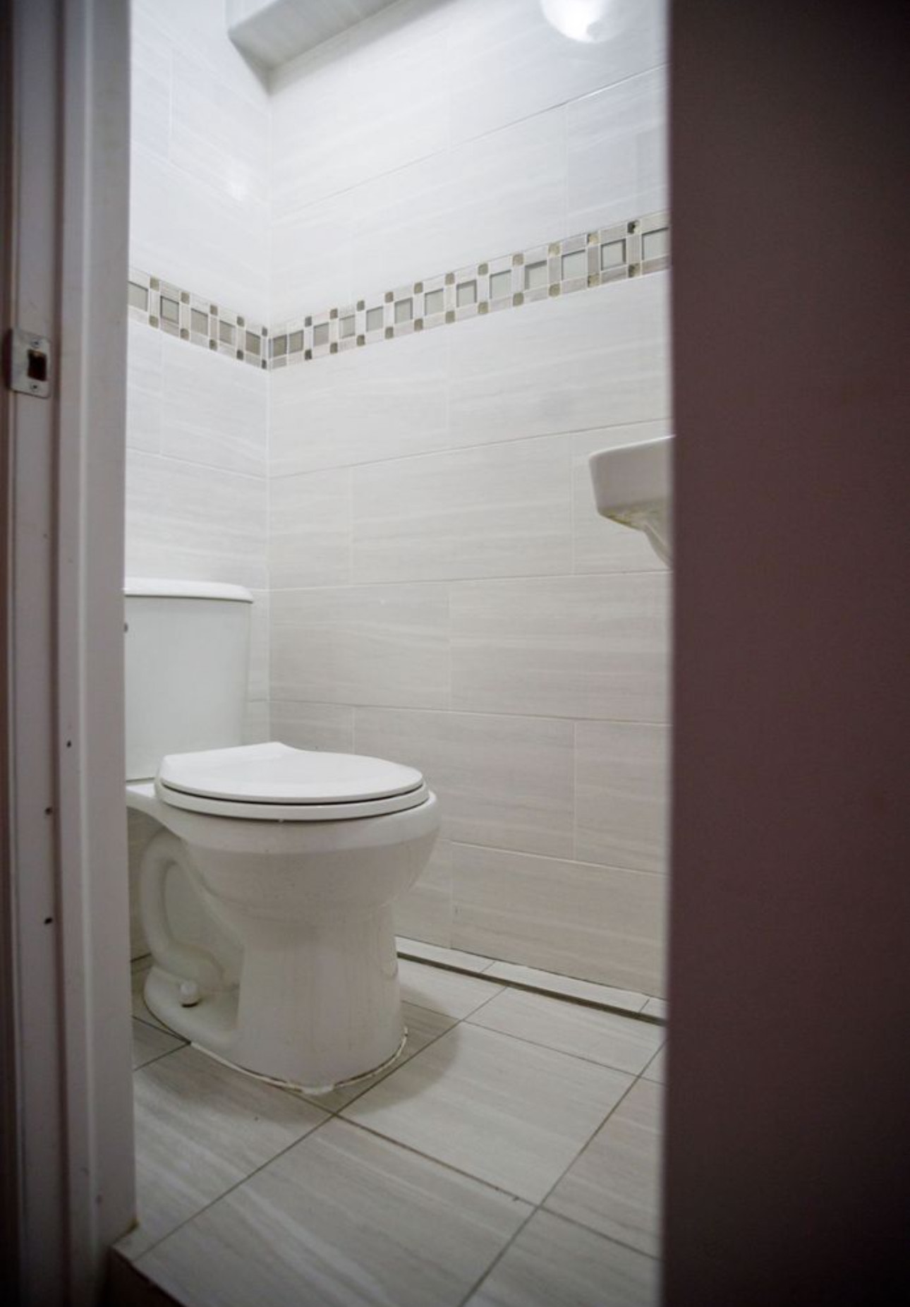 1729 East 54th Street, Unit 1 Brooklyn, NY 11234 - Photo 5 of 6 a bathroom with a toilet and a shower