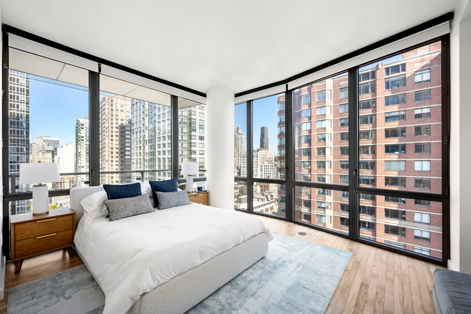 a bedroom with a large bed and a large window