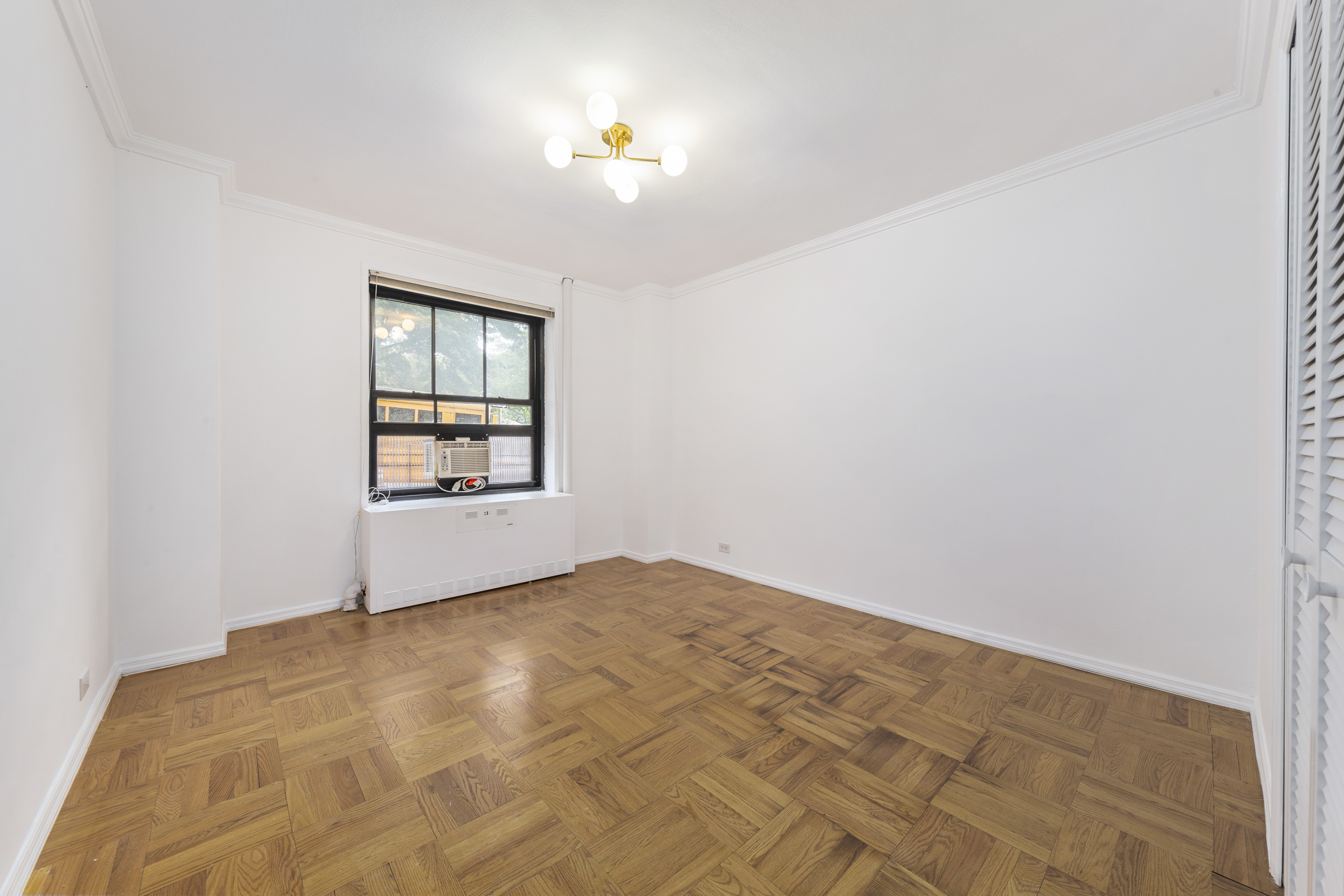 355 Clinton Avenue, Unit F1 Brooklyn, NY 11238 - Photo 11 of 20 an empty room with windows