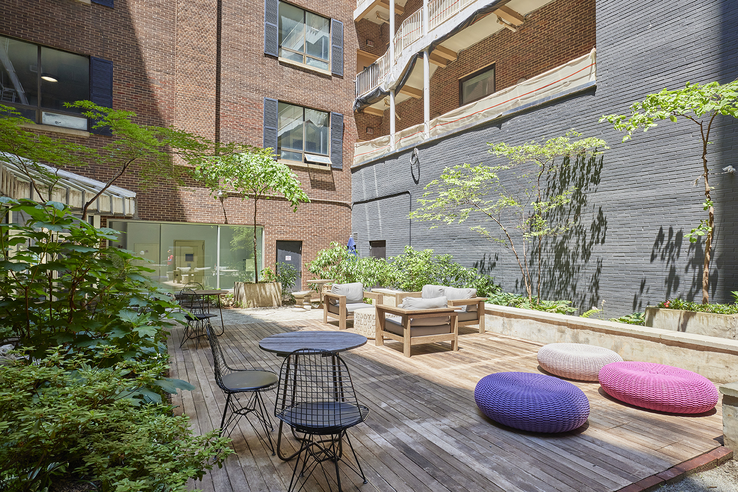 250 Mercer Street, Unit C603 Manhattan, NY 10012 - Photo 2 of 10 a backyard of a house with outdoor seating