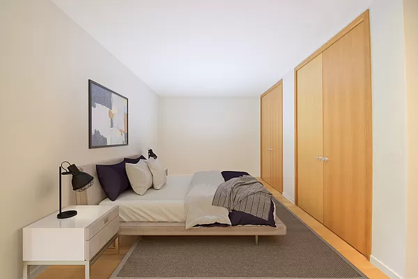 565 Broome Street, Unit N6J Manhattan, NY 10013 - Photo 6 of 27 a bedroom with a bed and window