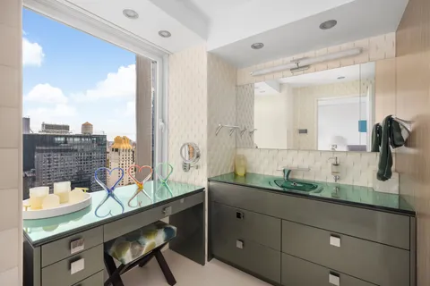 a bathroom with a toilet a sink and shower