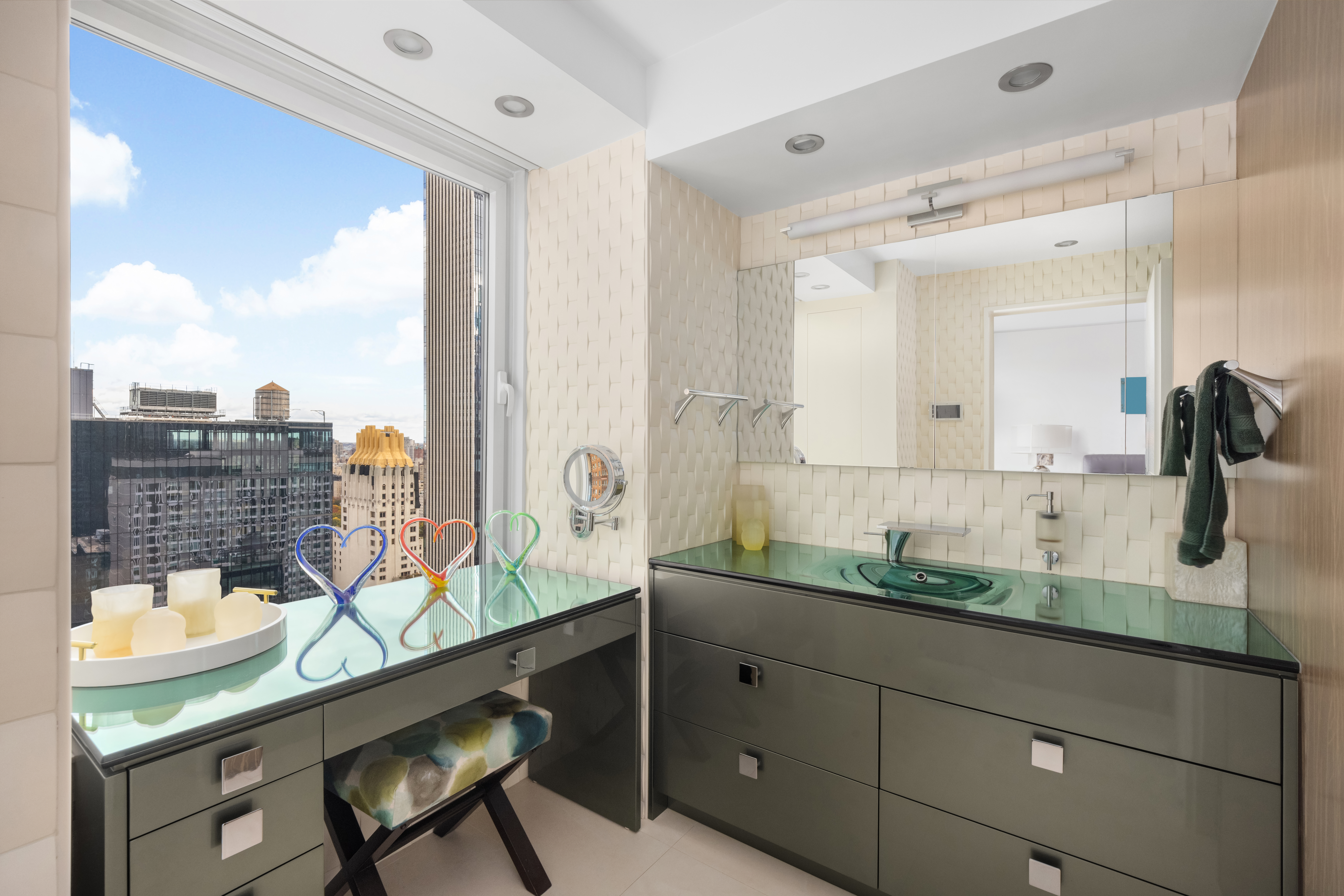 150 West 56th Street, Unit 3901 Manhattan, NY 10019 - Photo 9 of 25 a bathroom with a granite countertop sink and a mirror