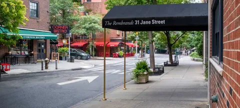 a view of street with an entrance and a building