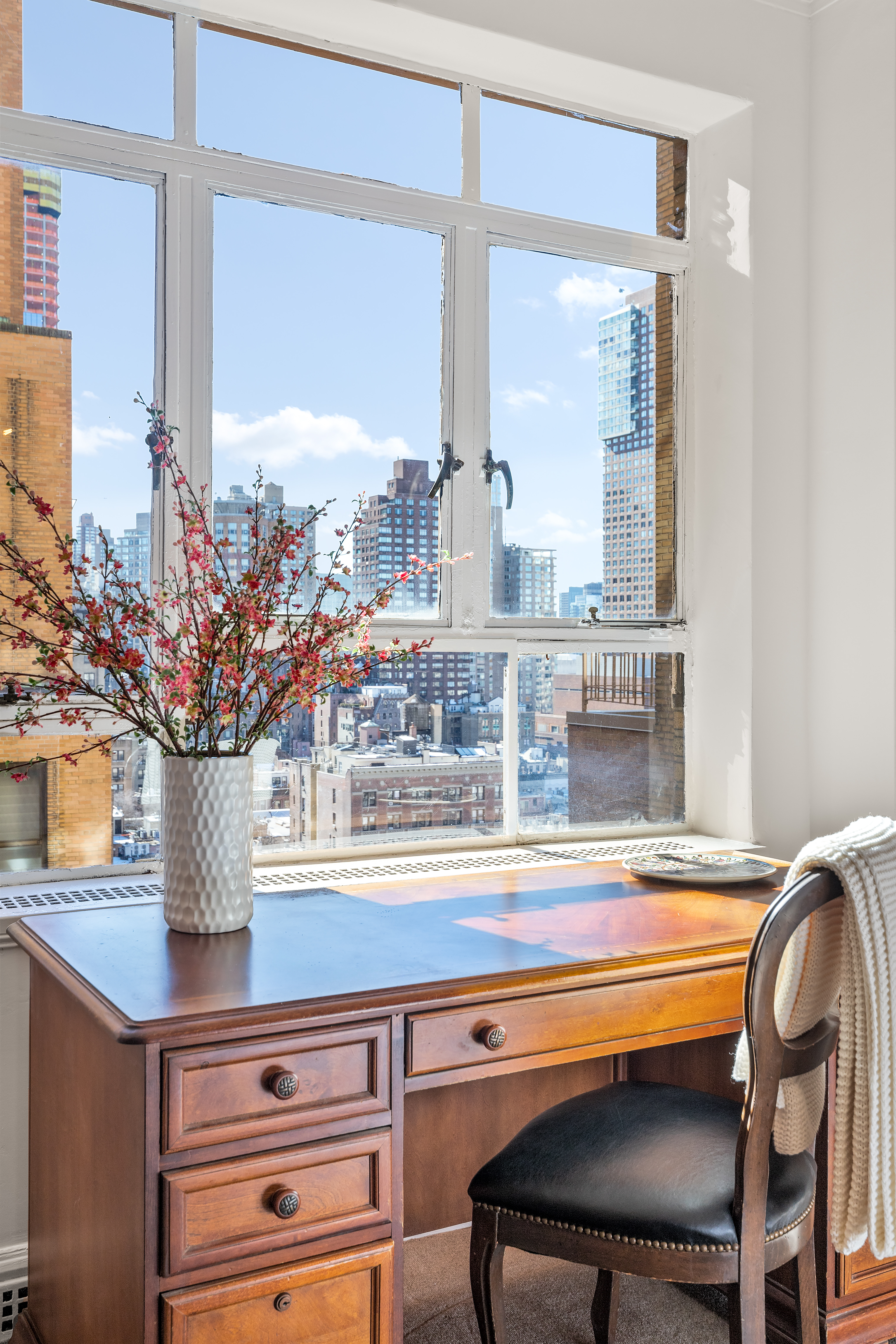 115 Central Park West, Unit 16H Manhattan, NY 10023 - Photo 15 of 30 a view of a dining room with furniture and a window