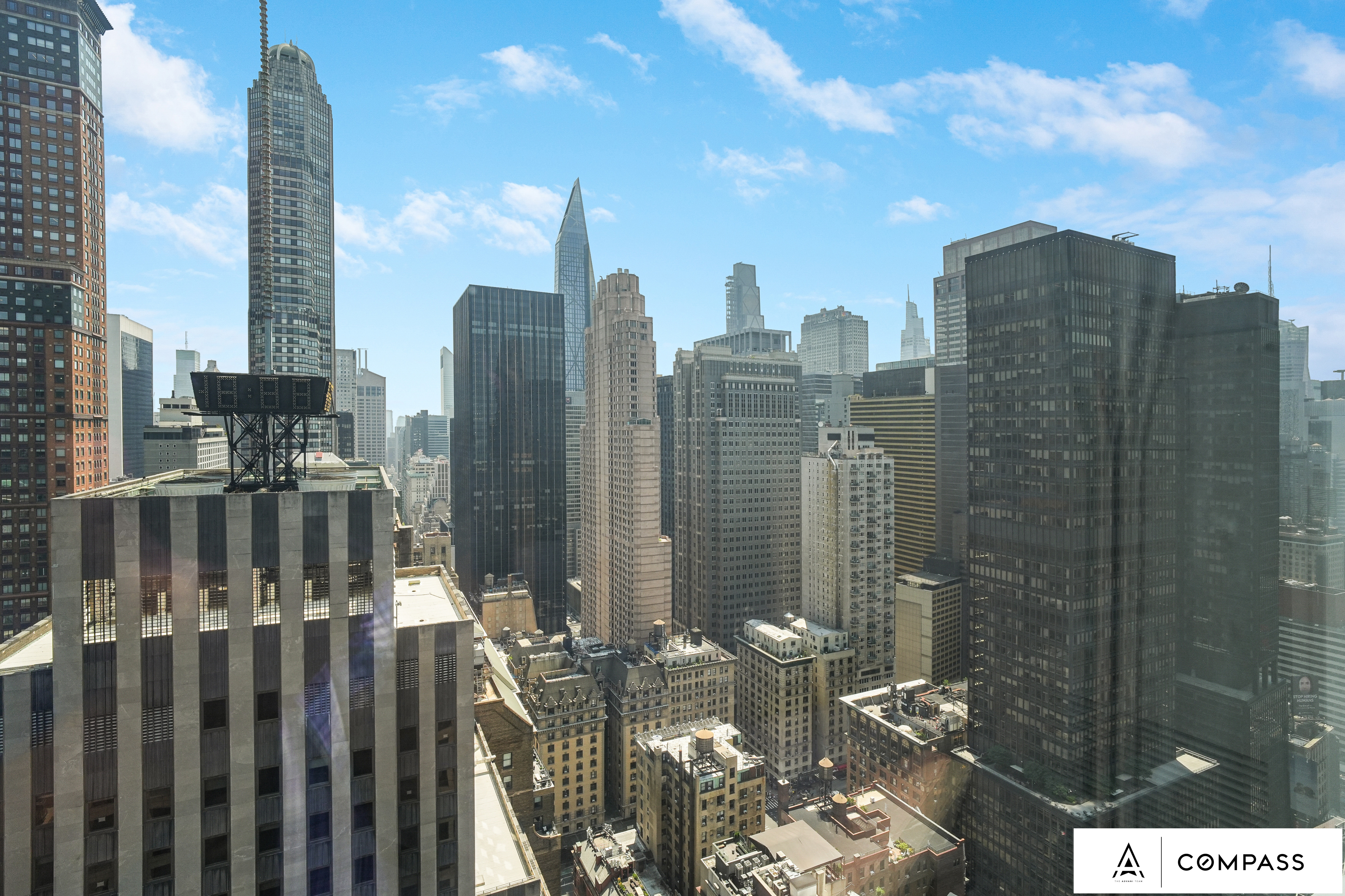 230 West 56th Street, Unit 49C Manhattan, NY 10019 - Photo 13 of 14 a view of a city with tall buildings