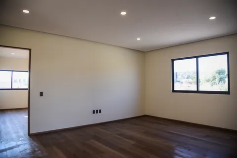 a kitchen with a sink and a refrigerator