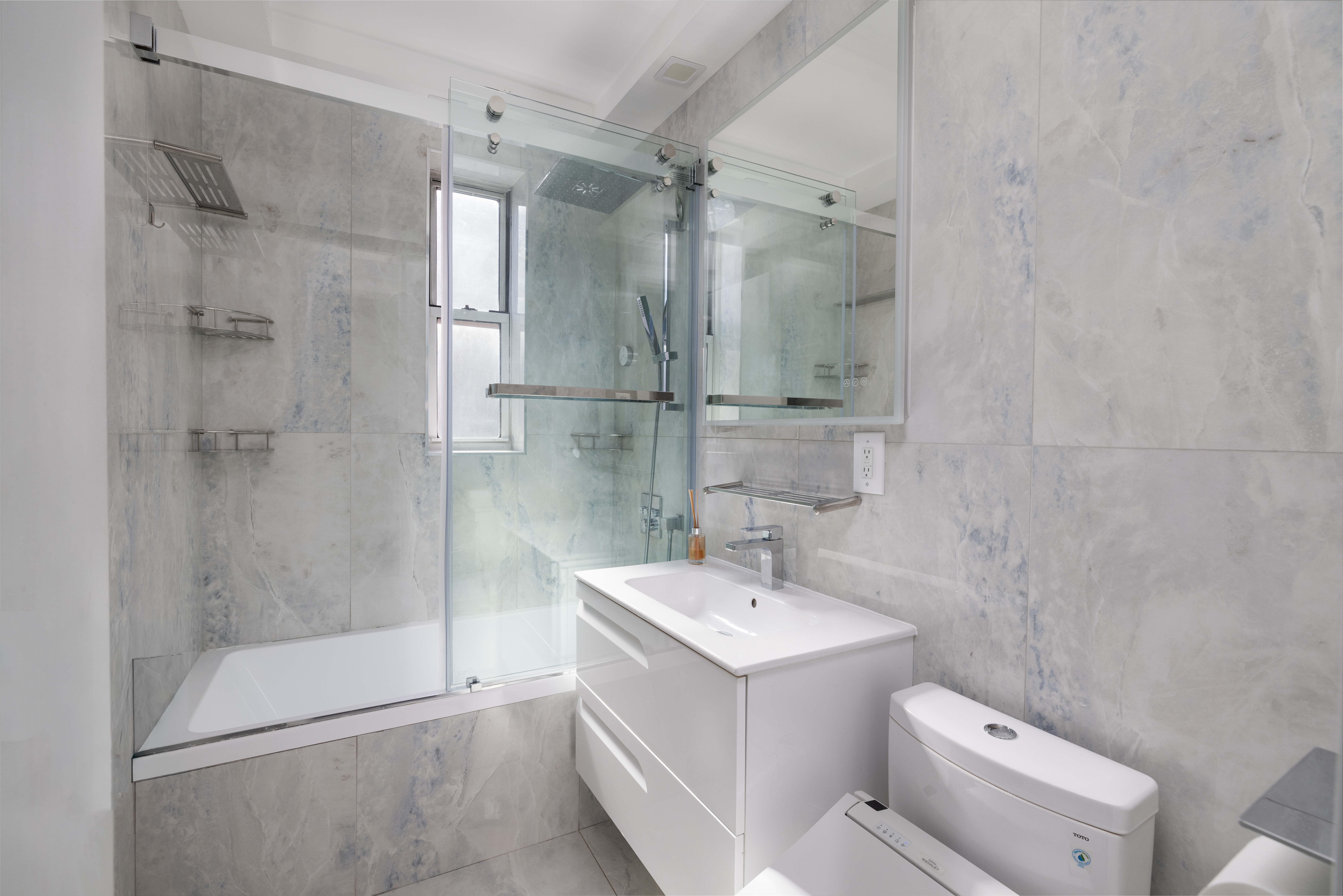 71-36 110th Street, Unit 4C Queens, NY 11375 - Photo 11 of 14 a bathroom with a sink toilet and shower