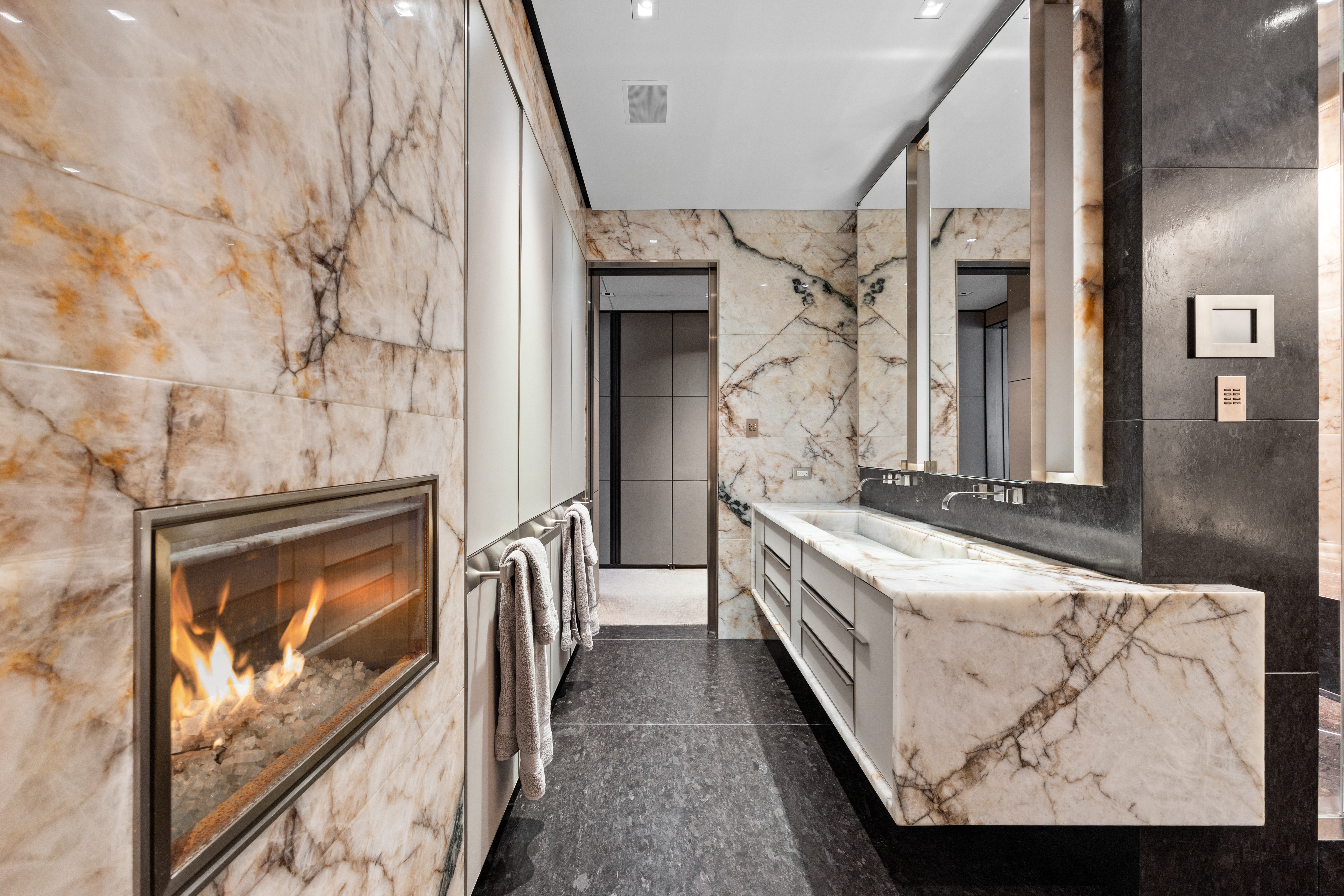 219 East 67th Street, Unit 5 Manhattan, NY 10065 - Photo 10 of 18 a en suite bathroom with a sink and a mirror