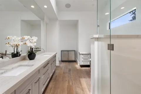 a kitchen with stainless steel appliances kitchen island granite countertop a refrigerator a stove a sink and a cabinets