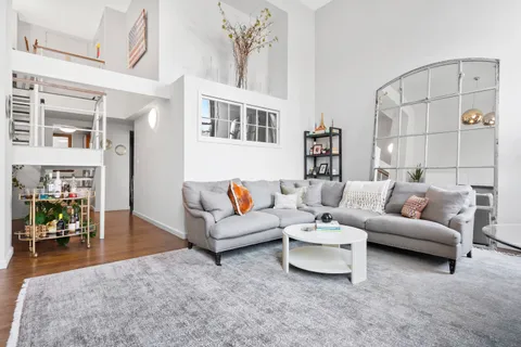 a living room with furniture and a table