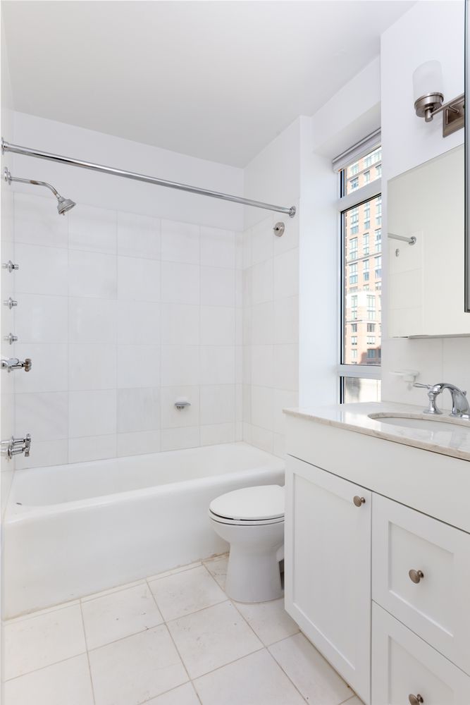 a bathroom with a sink a toilet and a bathtub