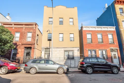 a car parked in front of a house