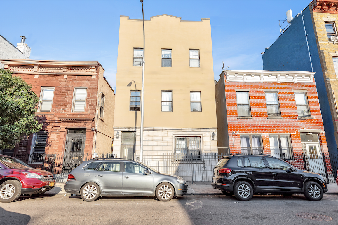 a car parked in front of a house