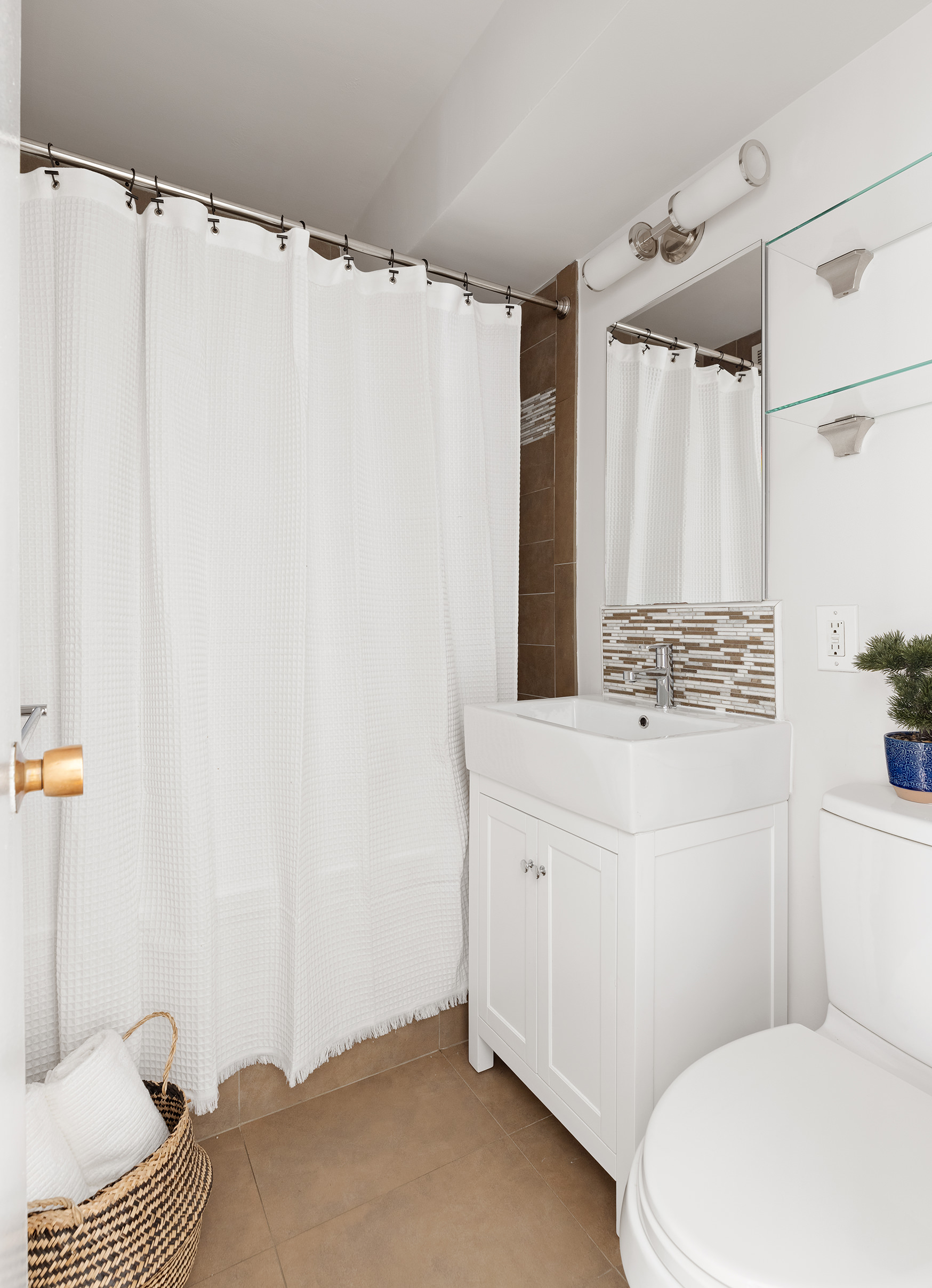 175 Adams Street, Unit 7A Brooklyn, NY 11201 - Photo 9 of 10 a bathroom with a sink toilet and shower