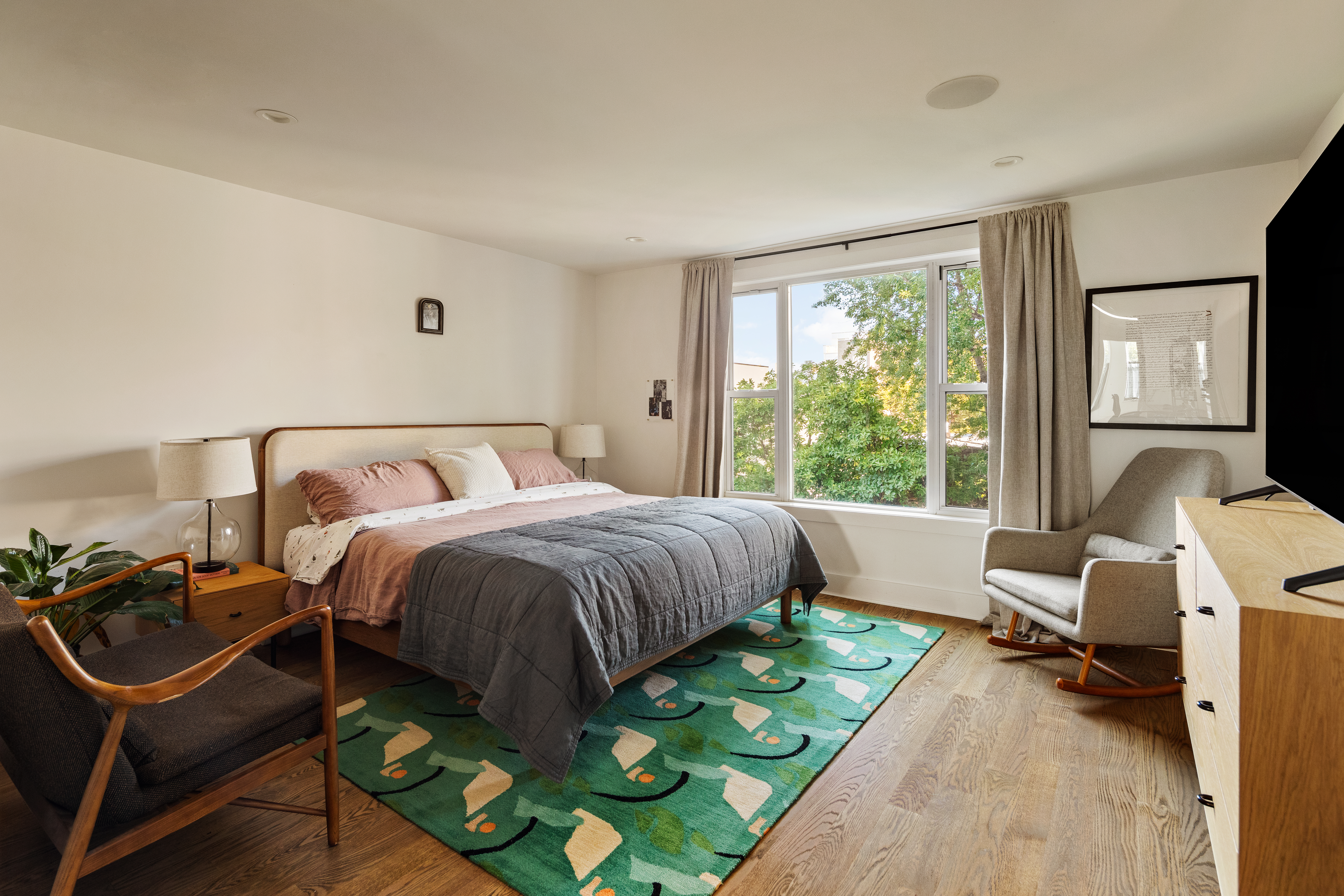 197 Madison Street Brooklyn, NY 11216 - Photo 7 of 19 a bedroom with a bed a table and chair