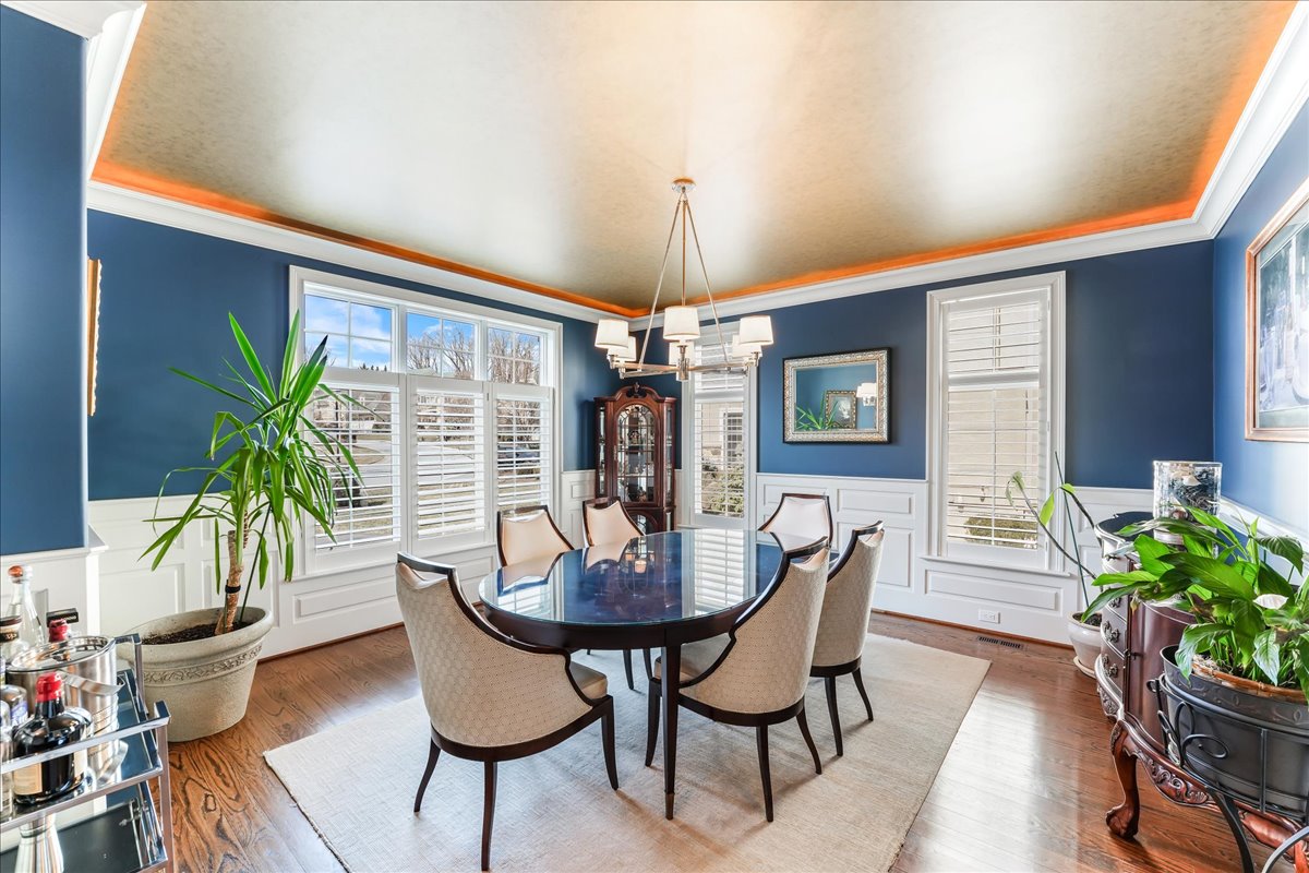 248 Valley Ridge Road Haverford, PA 19041 - Photo 6 of 44 a dining room with furniture potted plants and wooden floor