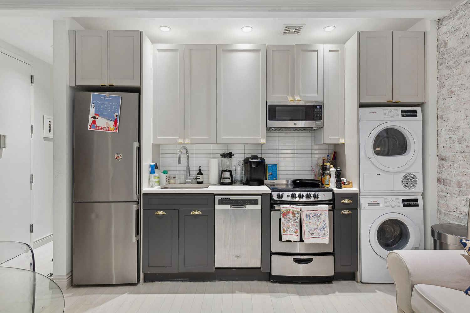 51 West 11th Street, Unit 3F Manhattan, NY 10011 - Photo 2 of 6 a kitchen with stainless steel appliances granite countertop a stove a refrigerator and a white cabinets