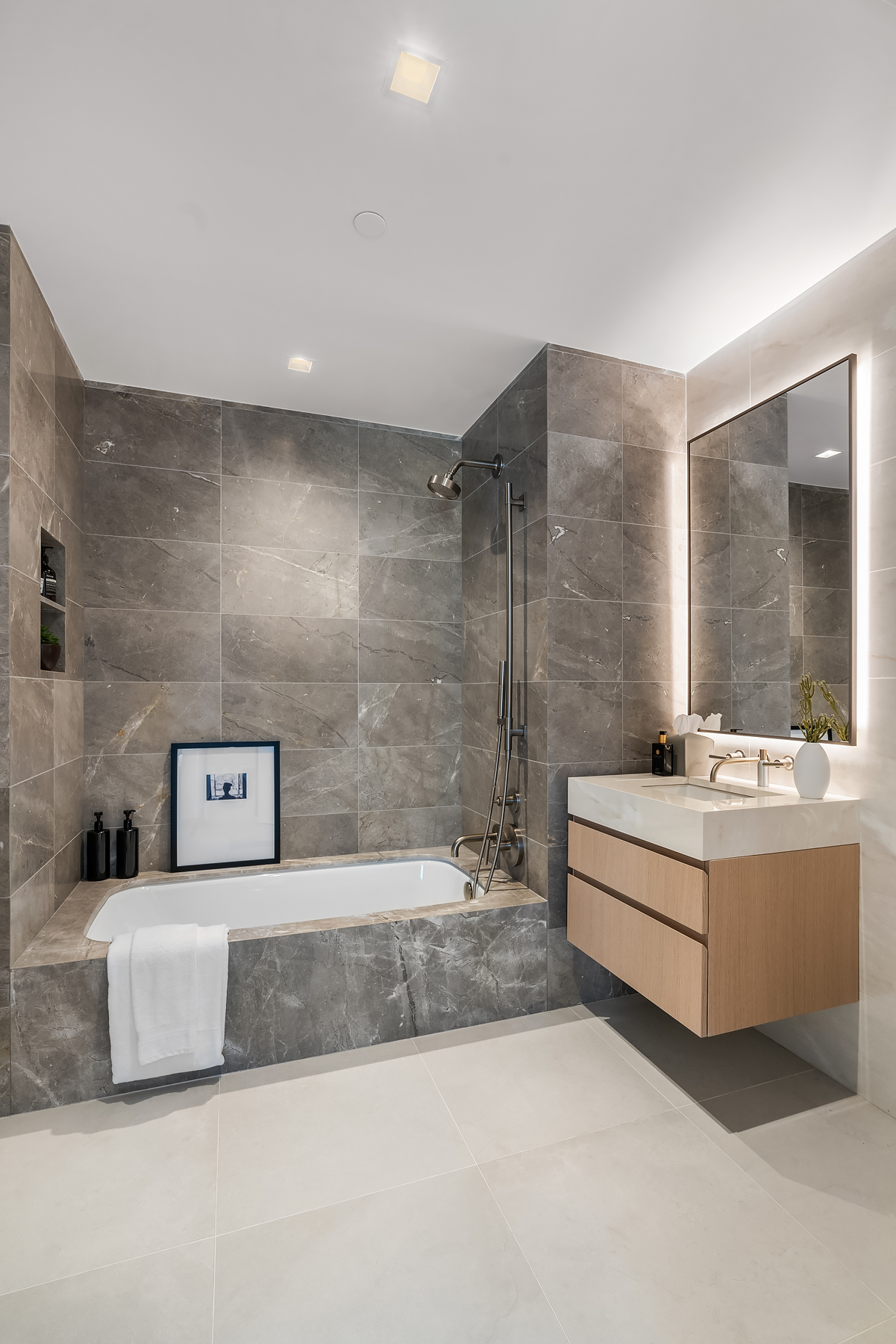 101 West 14th Street, Unit 3D Manhattan, NY 10011 - Photo 5 of 14 a bathroom with a bathtub and sink