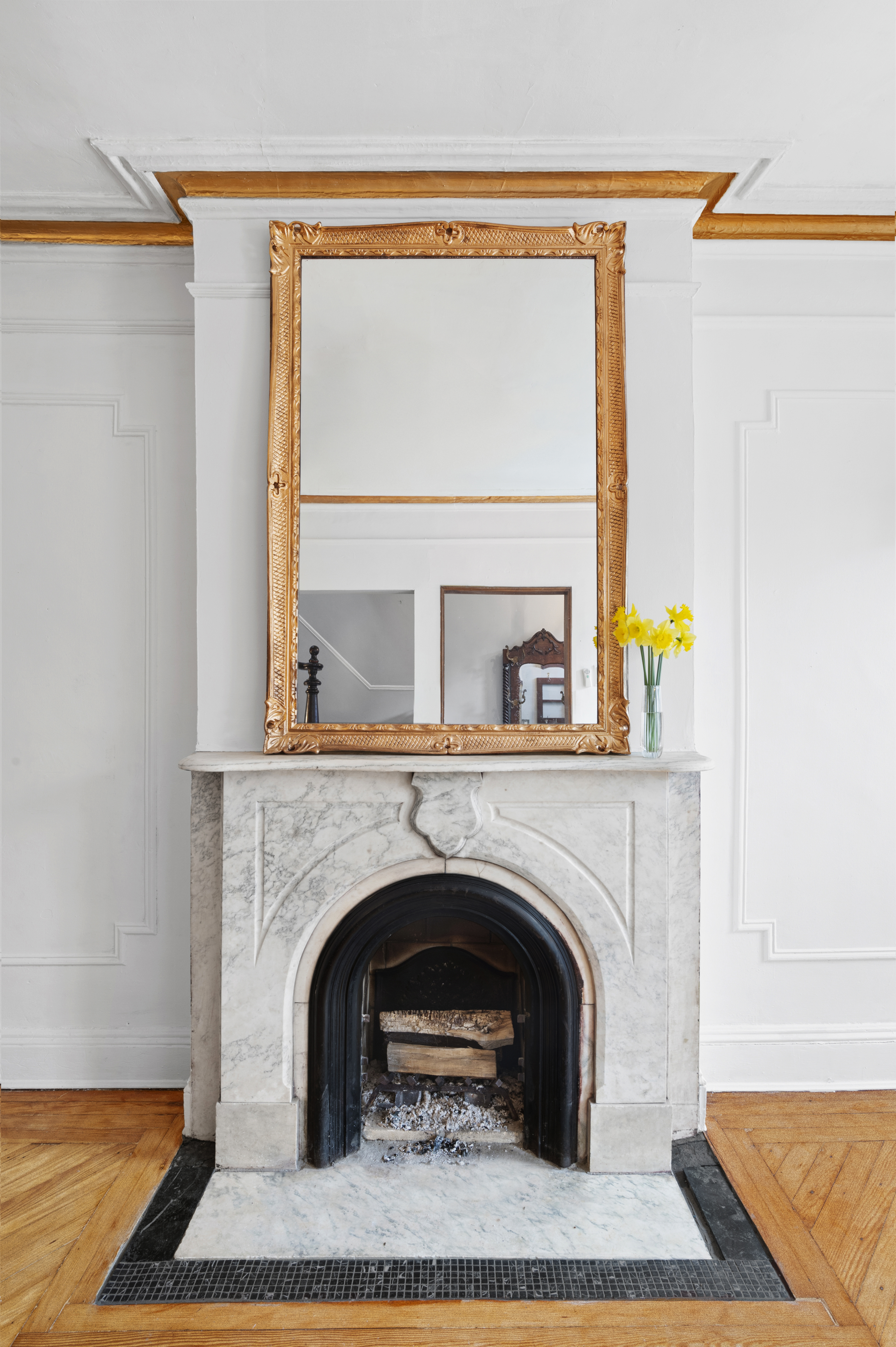 457 Warren Street Brooklyn, NY 11217 - Photo 3 of 16 a living room with a fireplace and a table