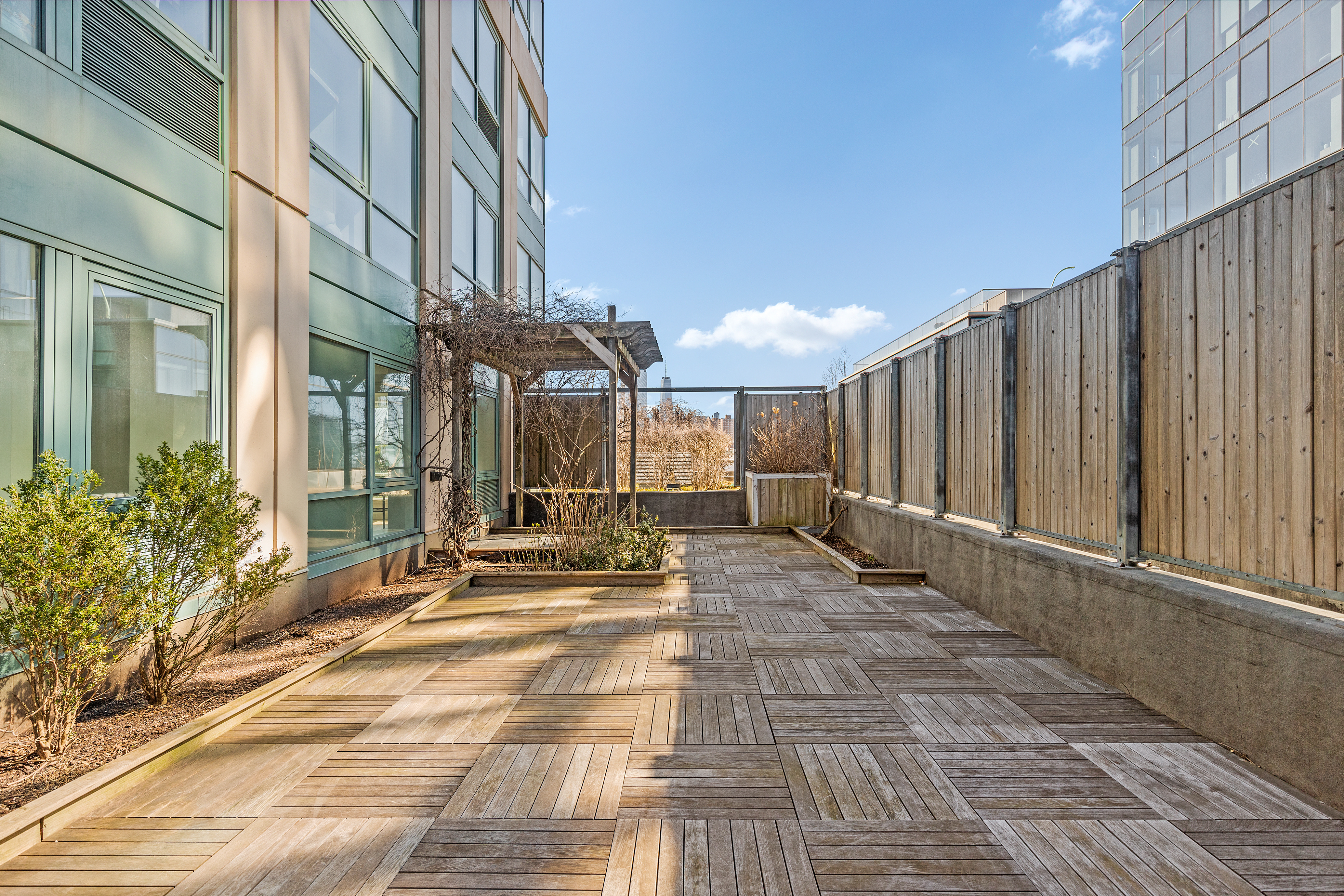 440 Kent Avenue, Unit 1B Brooklyn, NY 11249 - Photo 16 of 20 a view of a building with sitting area