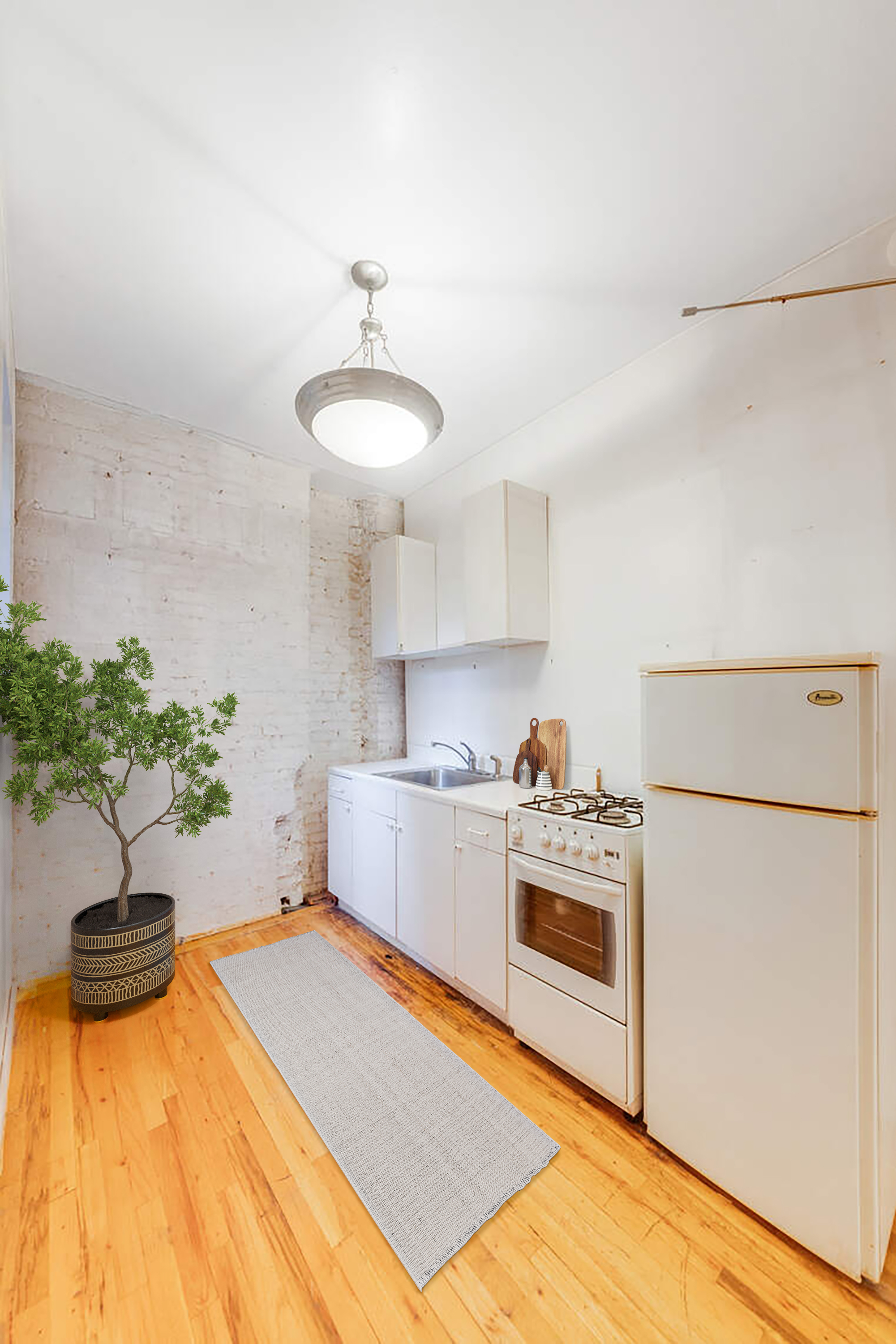 604 Riverside Drive, Unit 1B Manhattan, NY 10031 - Photo 5 of 14 a kitchen with kitchen island a stove a sink and a refrigerator
