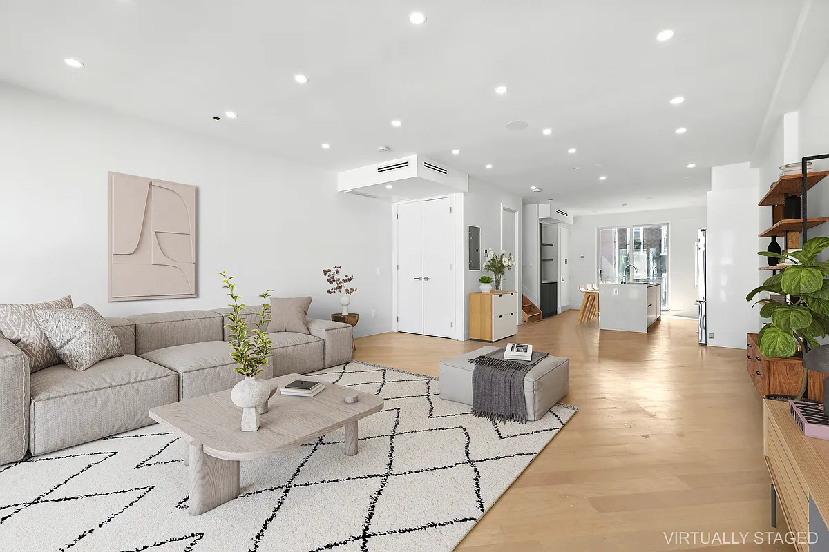 483 Hart Street, Unit PH Brooklyn, NY 11221 - Photo 2 of 17 a living room with furniture and a potted plant