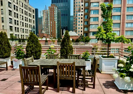 a front view of a building with outdoor seating