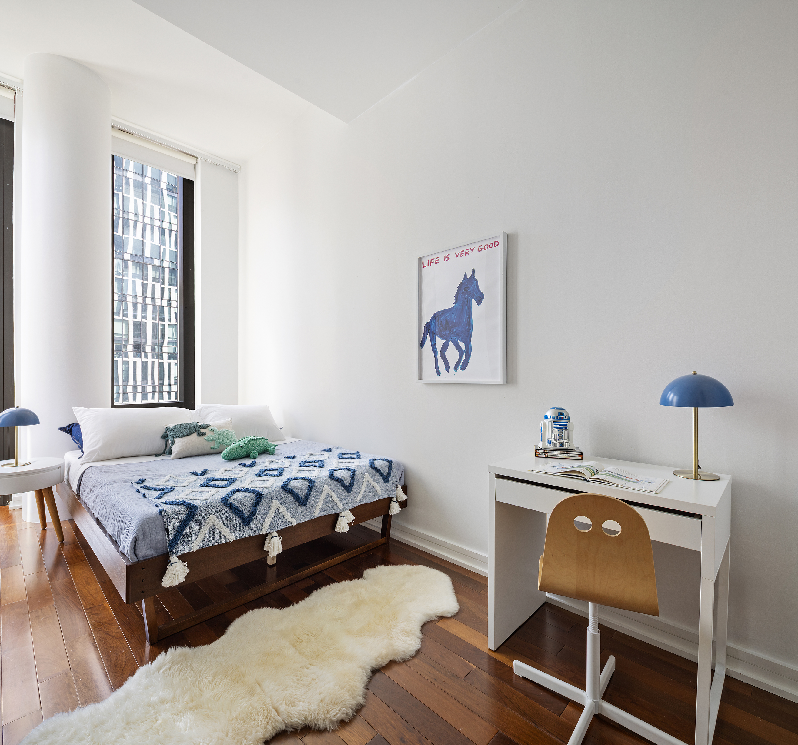 101 Warren Street, Unit 12L Manhattan, NY 10007 - Photo 15 of 28 a bedroom with a bed and a chair with the wooden floor