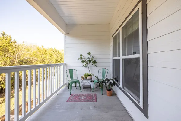 a view of balcony with furniture