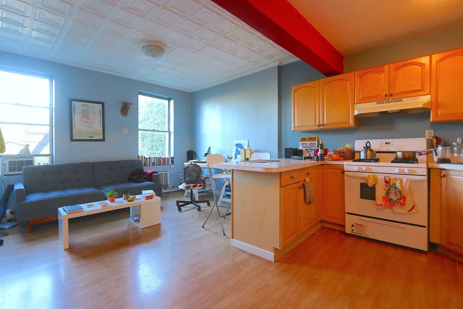 a view of kitchen with furniture and wooden floor
