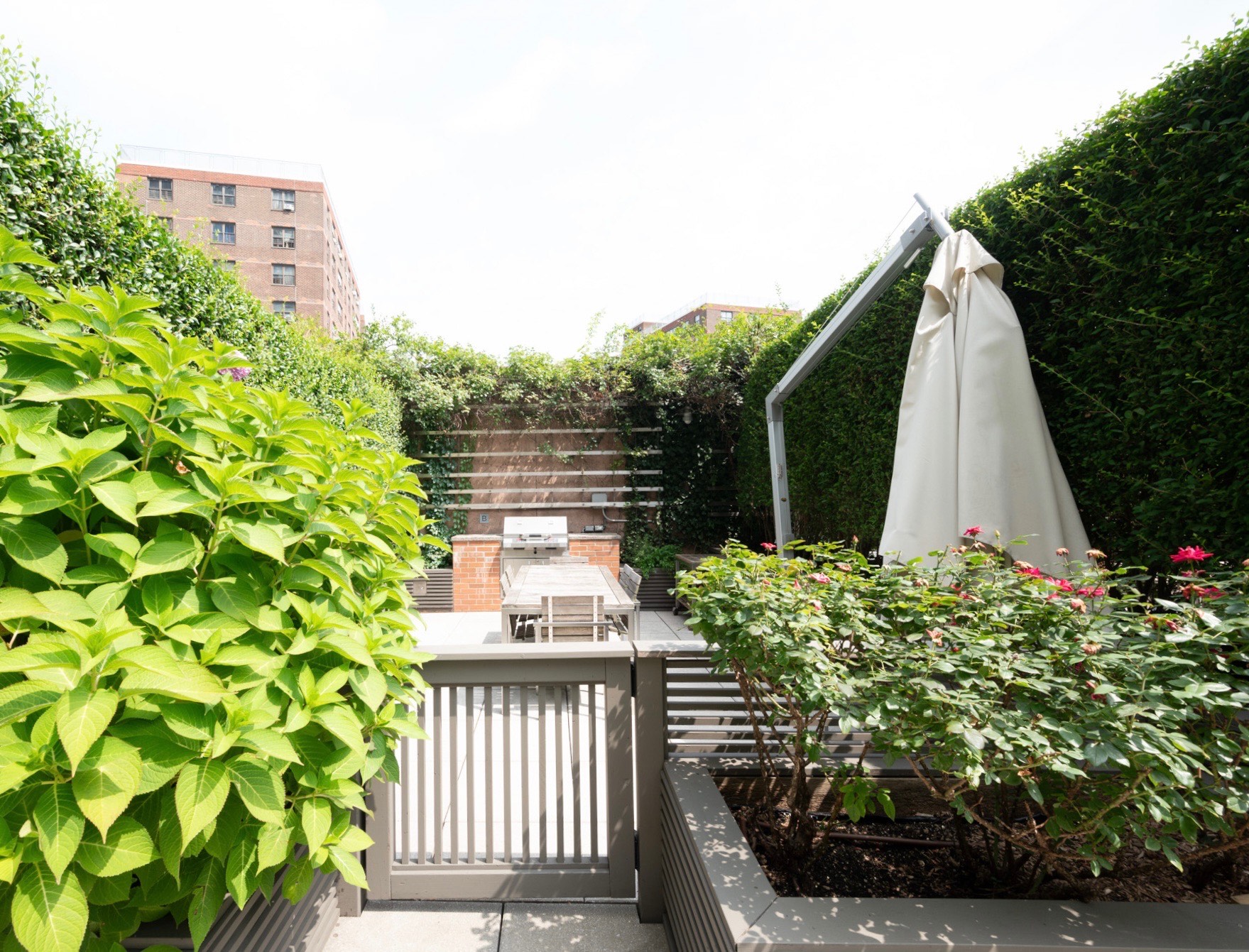 215-217 East 96th Street, Unit 25B Manhattan, NY 10128 - Photo 15 of 19 a view of a house with backyard and sitting area
