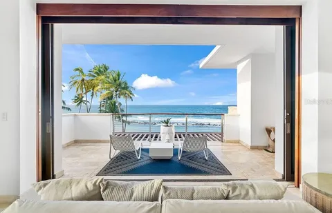 a living room with furniture and a rug